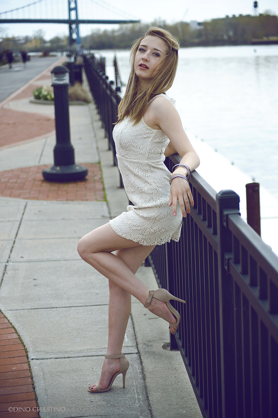 sam chambers posing on a river fence for dino celestino